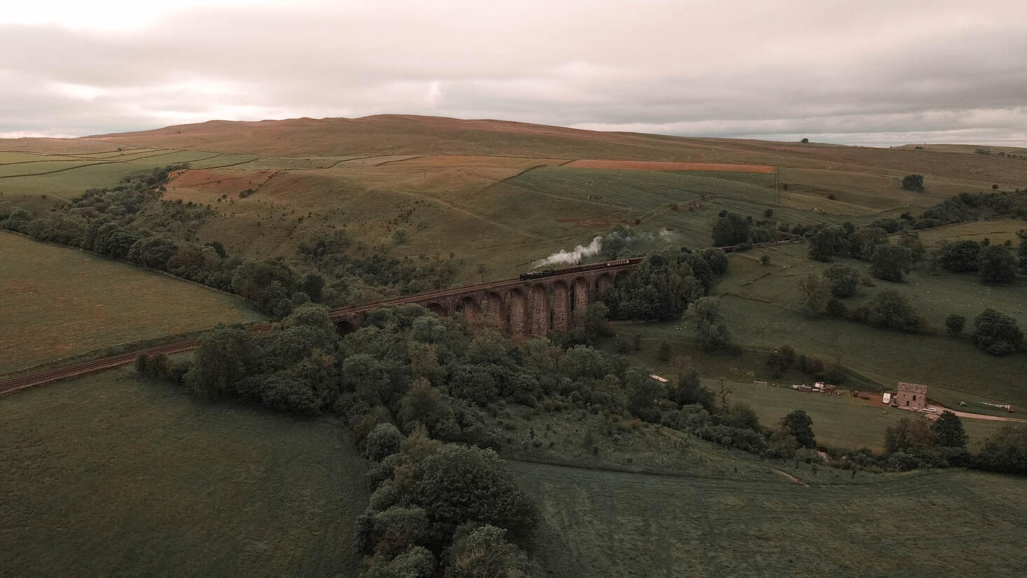 Vintage Heritage Steam Train on a Viaduct in the Yorkshire Dales 4K Drone Photo